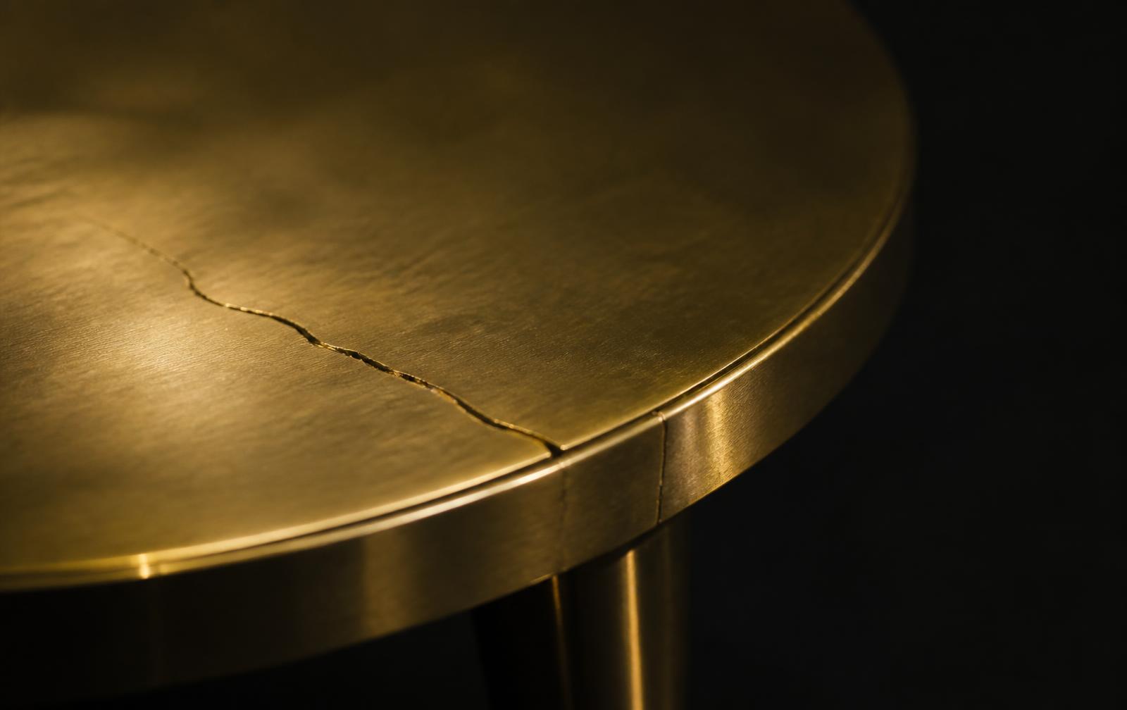 A fine crack across a polished gold surface